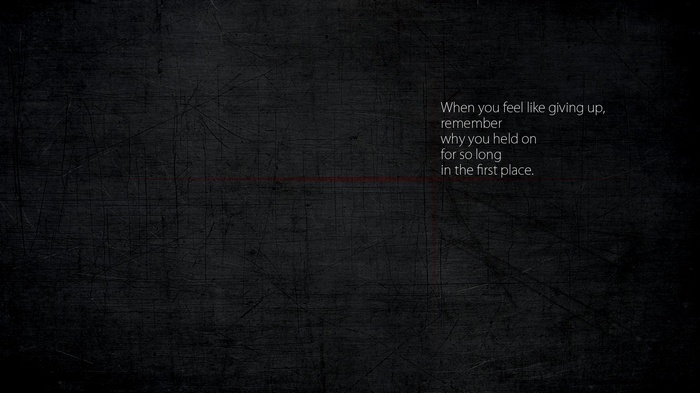 Motivational quote on a dark textured background