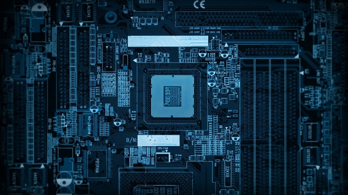 Close-up of a blue computer motherboard with CPU socket