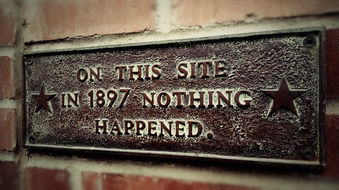 Plaque on brick wall: In 1897 nothing happened