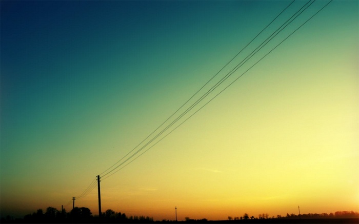 Power lines against a gradient sky at sunset