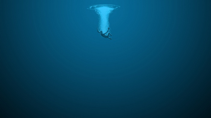 Person falling into deep blue water