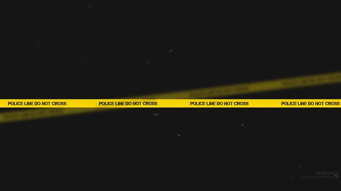 Police tape with "POLICE LINE DO NOT CROSS" text