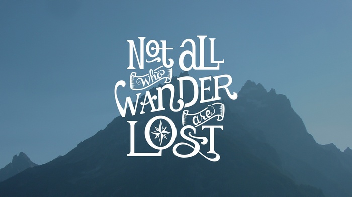 Not all who wander are lost typography on mountains