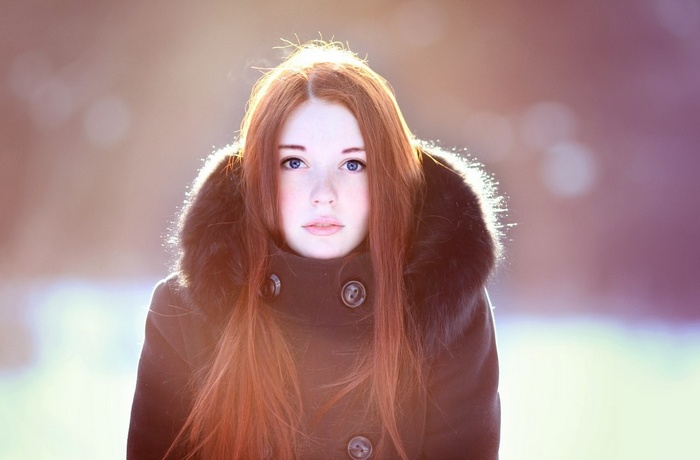 Lina Pegushina in a black coat with fur hood