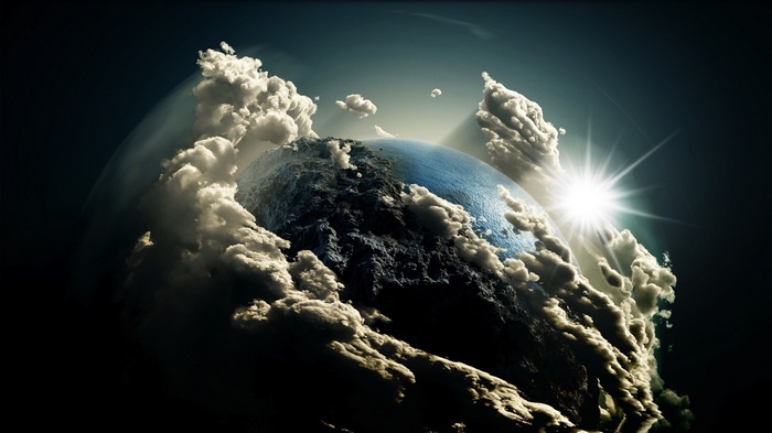 Earth with clouds and sunburst