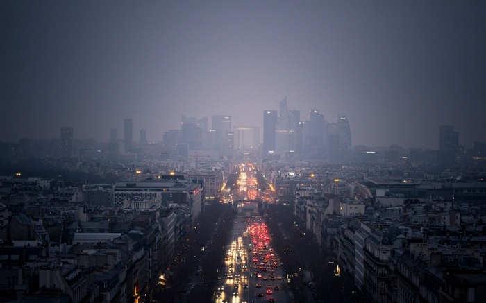 Paris cityscape at dusk with traffic lights