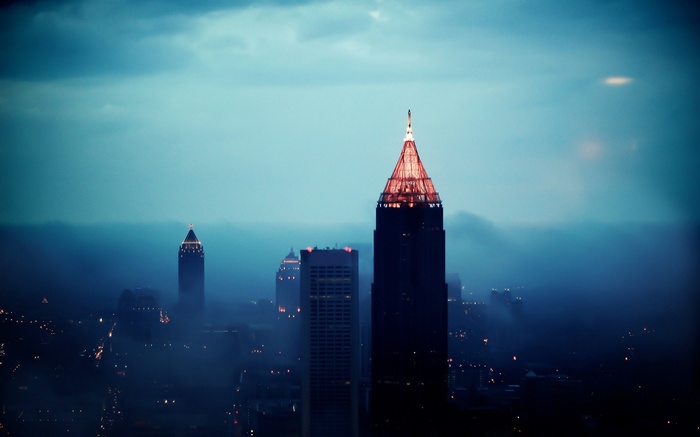 Atlanta cityscape shrouded in mist at dusk