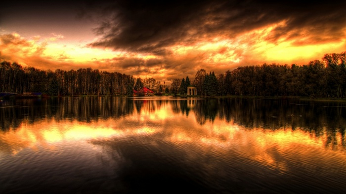 Lake with dramatic sunset clouds and reflections