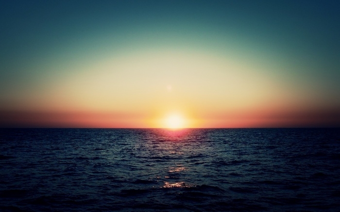 Sunset over the ocean with colorful sky