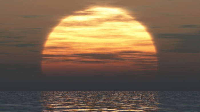 Sunset over the sea with clouds