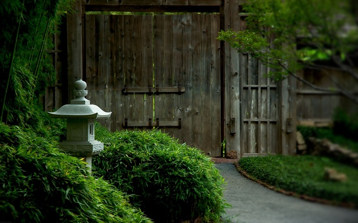 Japanese Garden with Wooden Gate and Stone Lantern