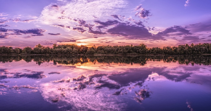 Sunset over a lake with reflections