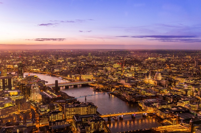 Aerial view of London at dusk with the River Thames