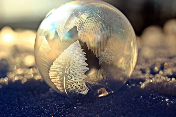 Frozen bubble with frost patterns on the ground