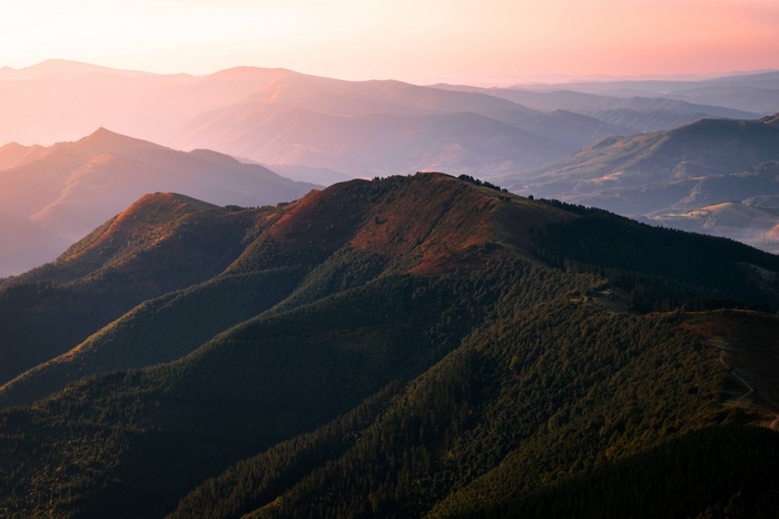 Mountain range at sunset with pink sky
