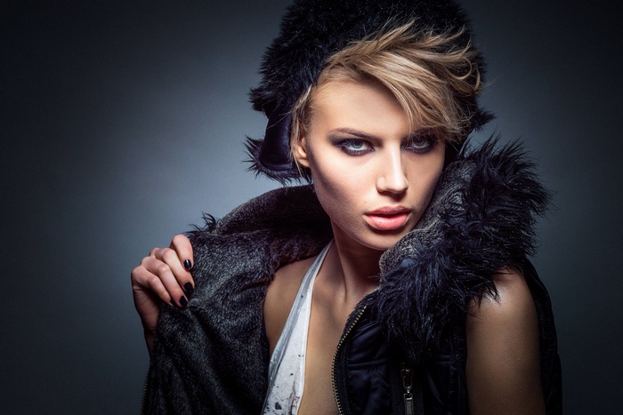 Fashionable woman in fur hat and coat