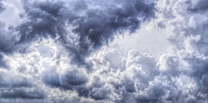 Stormy Cumulus Clouds with Sunbeams