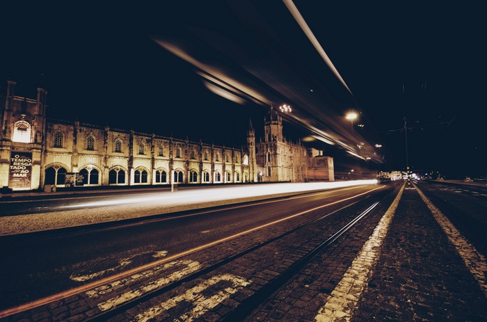 Jerónimos Monastery at night with light trails