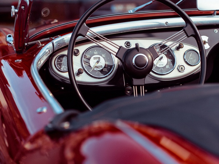 Close-up of a classic red convertible car dashboard