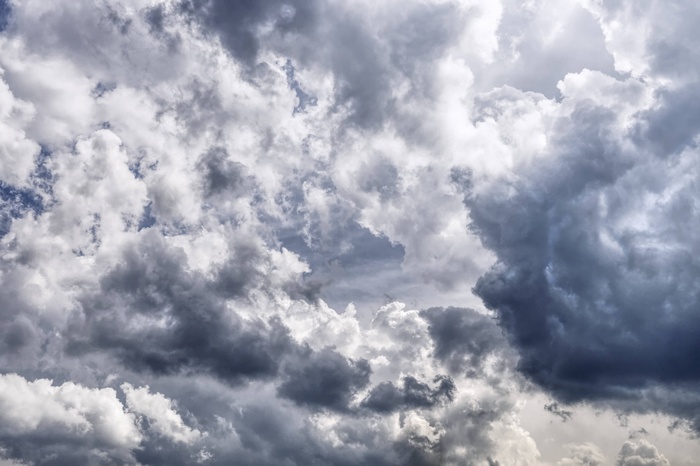 Dark and light clouds fill the sky
