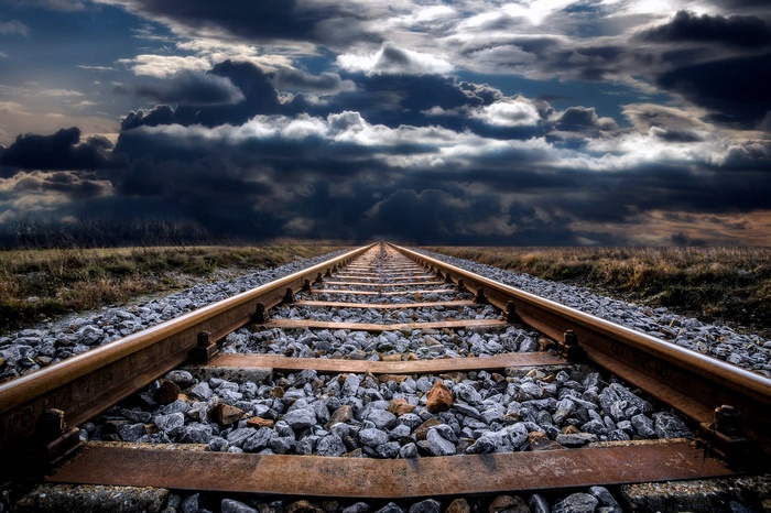 Abandoned Old Railway Track Under Dramatic Sky