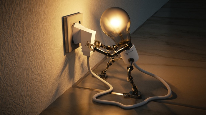 Light bulb character plugs itself into a wall socket