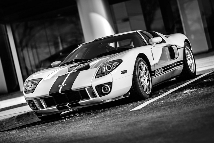 Black and white Ford GT supercar with racing stripes