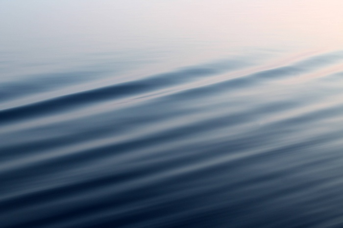 Blue water surface with gentle ripples