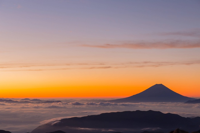 Sunrise over Mt. Fuji with clouds and mountains
