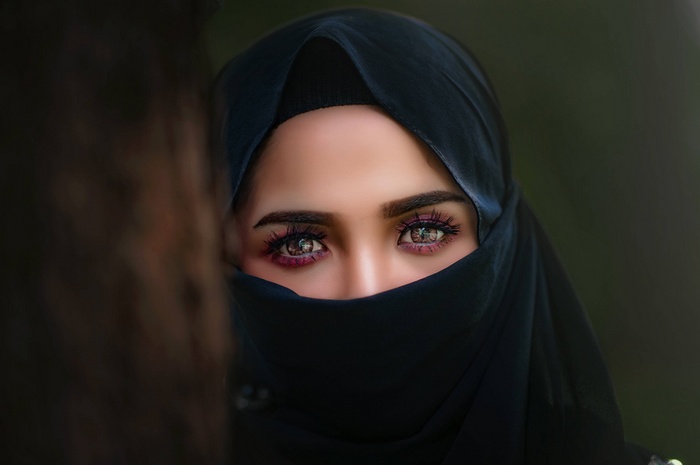 Woman wearing a black hijab and veil