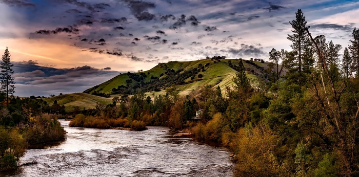 Evening landscape with hills and river in California
