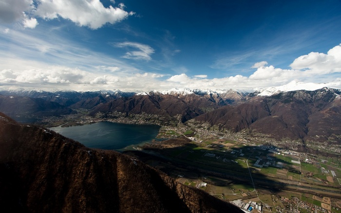 Lake and snow-capped mountains from a high vantage point