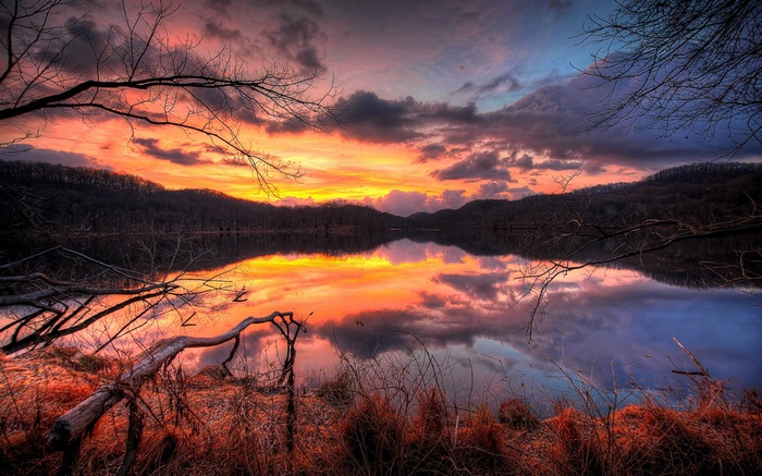 Sunset over a lake with reflections