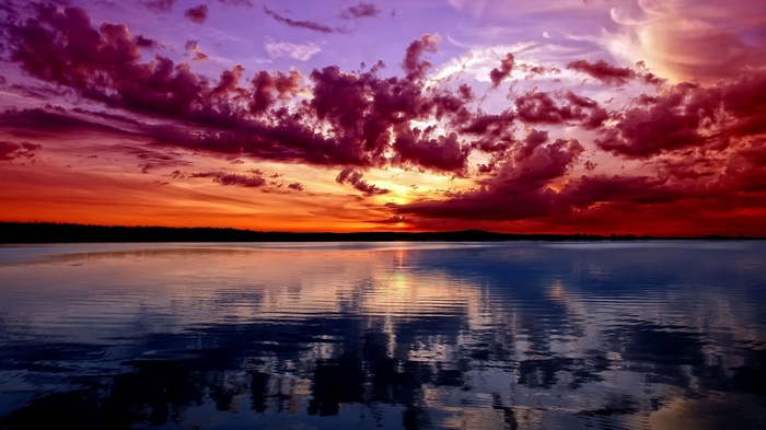 Dramatic sunset over a calm lake