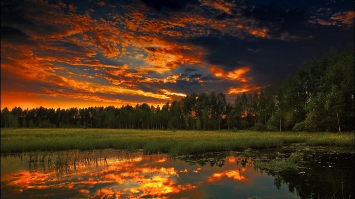 Sunset over a lake with reflections