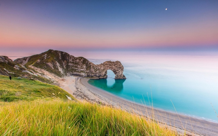 Durdle Door Arch at Sunrise with Moon