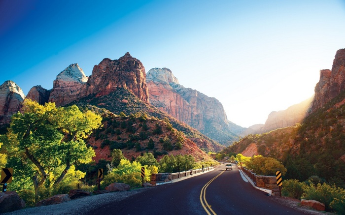 Road through Zion National Park with mountains