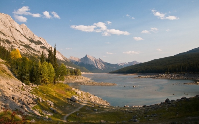 Rocky mountains and lake under a blue sky
