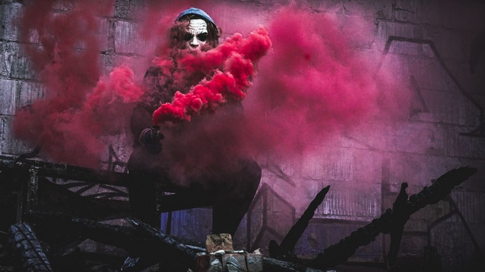 Joker with red smoke bomb