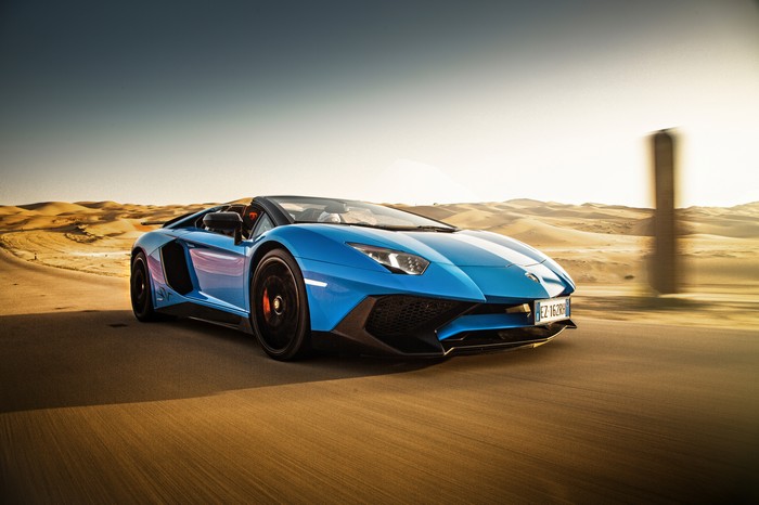 Blue Lamborghini Aventador driving in desert