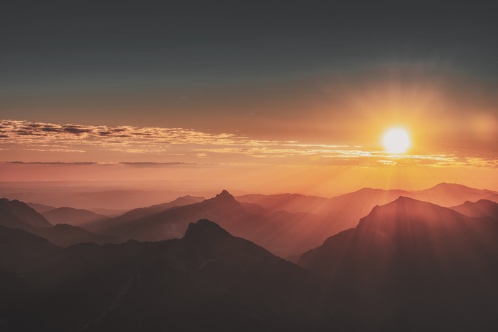 Sunrise over misty mountains in 4K