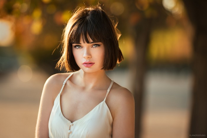 Young woman with bob haircut and bangs