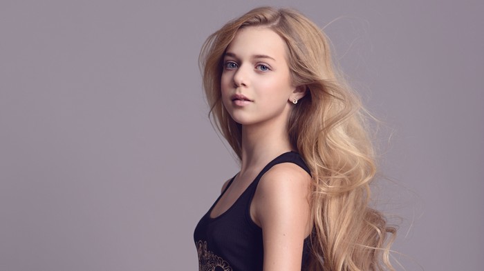 Portrait of Blonde Girl with Flowing Hair in Soft Light 4K