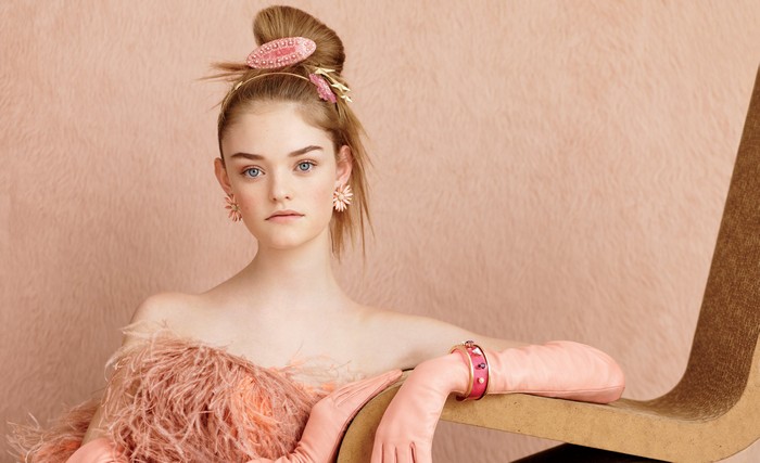 Girl with pink accessories and feather dress