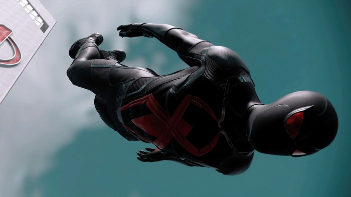 Spider-Man in a black and red suit flying