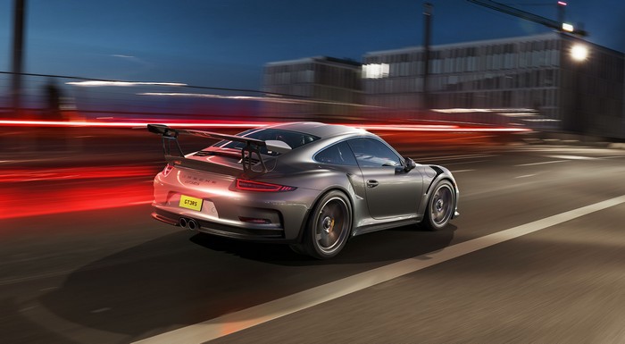 Porsche GT3 RS driving on a city street at night