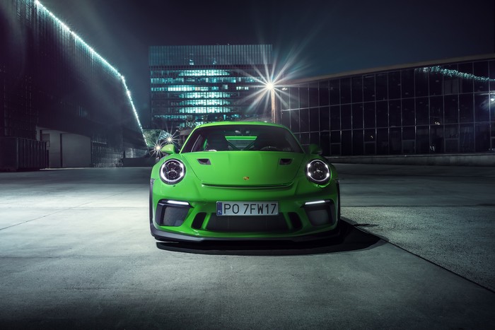 Green Porsche 911 GT3 R parked at night