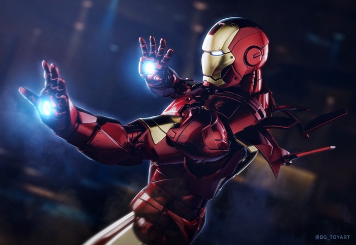 Iron Man in red and gold suit with repulsor blasts
