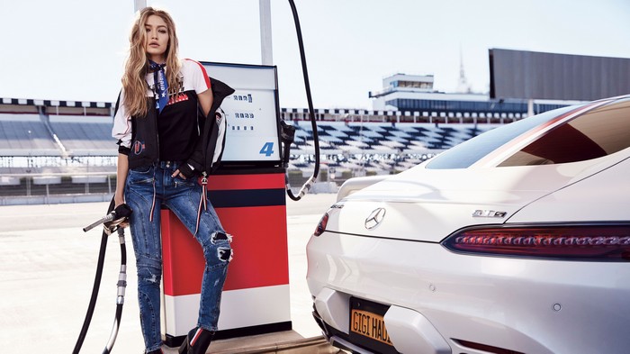 Gigi Hadid at a gas station with a Mercedes-AMG GT S