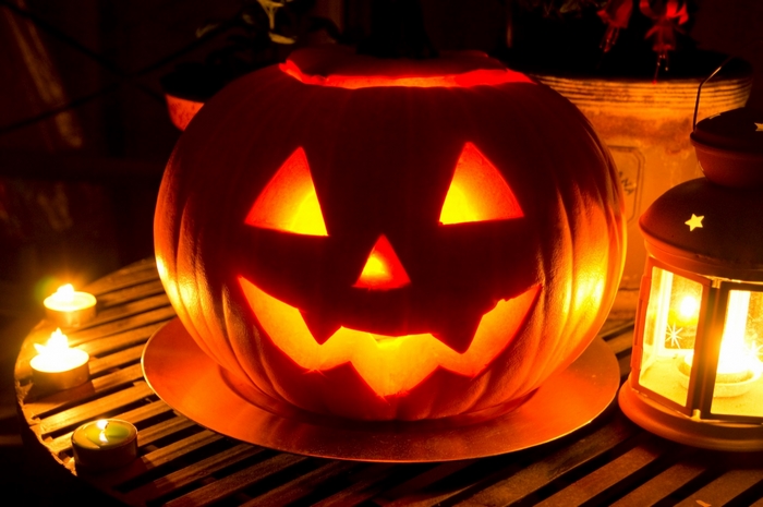 Jack-o'-lantern with candles and lantern